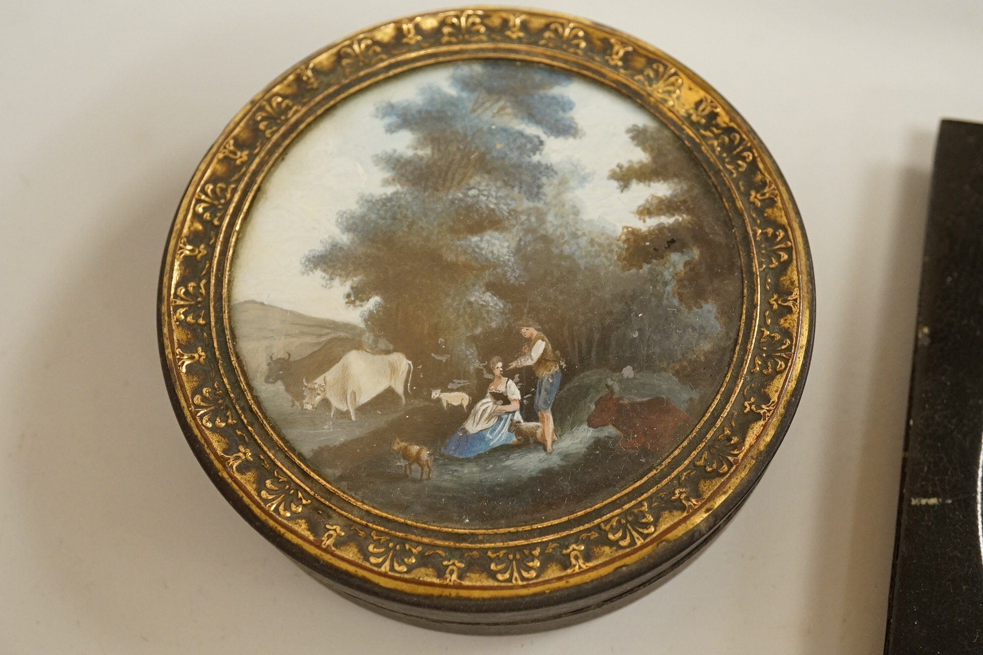 A collection of 19th century and later snuff and pill boxes, a silhouette frame and a gilt metal frame